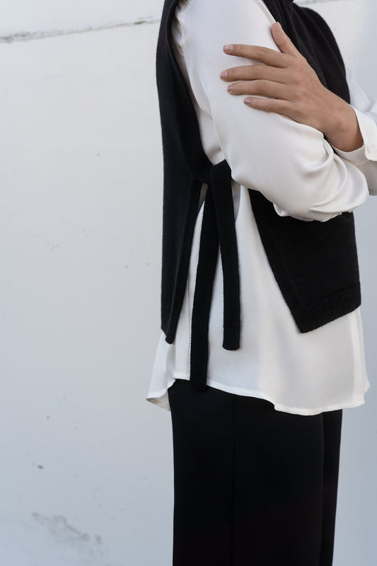 black wool collar over white silk shirt