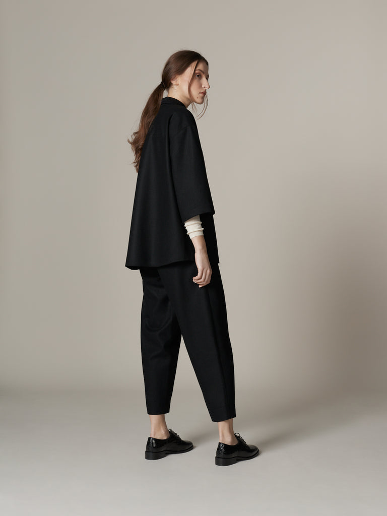 Minimalist sleek black wool outfit