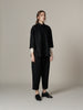Minimalist sleek black wool outfit
