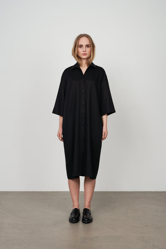 Womens black shirt dress with boxy minimalist silhouette.