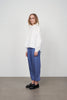 Archetype women's white cotton shirt with grandad collar, loose silhouette and wide sleeves. 